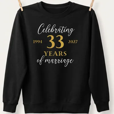 33 Years of Marriage shirt featuring elegant lettering in gold and white — printed on a unisex sweatshirt