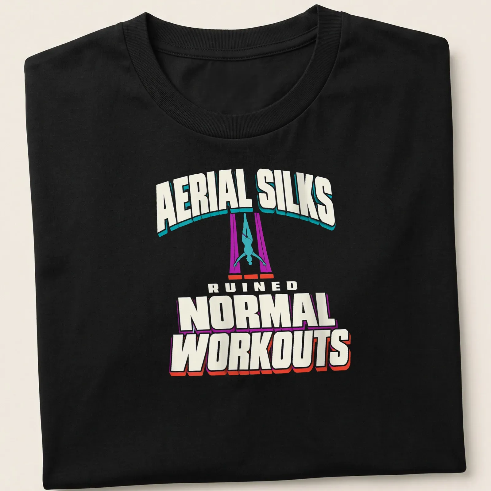 Bold graphic t-shirt featuring aerial silks performer and playful text — printed on a unisex t-shirt