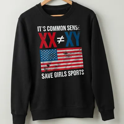 Distressed vintage T-shirt with American flag and bold text on saving girls sports. — printed on a unisex sweatshirt