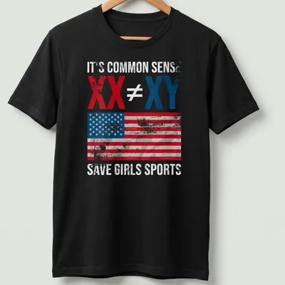 Distressed vintage T-shirt with American flag and bold text on saving girls sports.