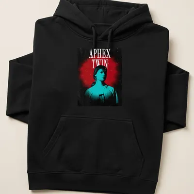 Retro graphic tee featuring a bold portrait of Aphex Twin with colorful text. — printed on a unisex hoodie