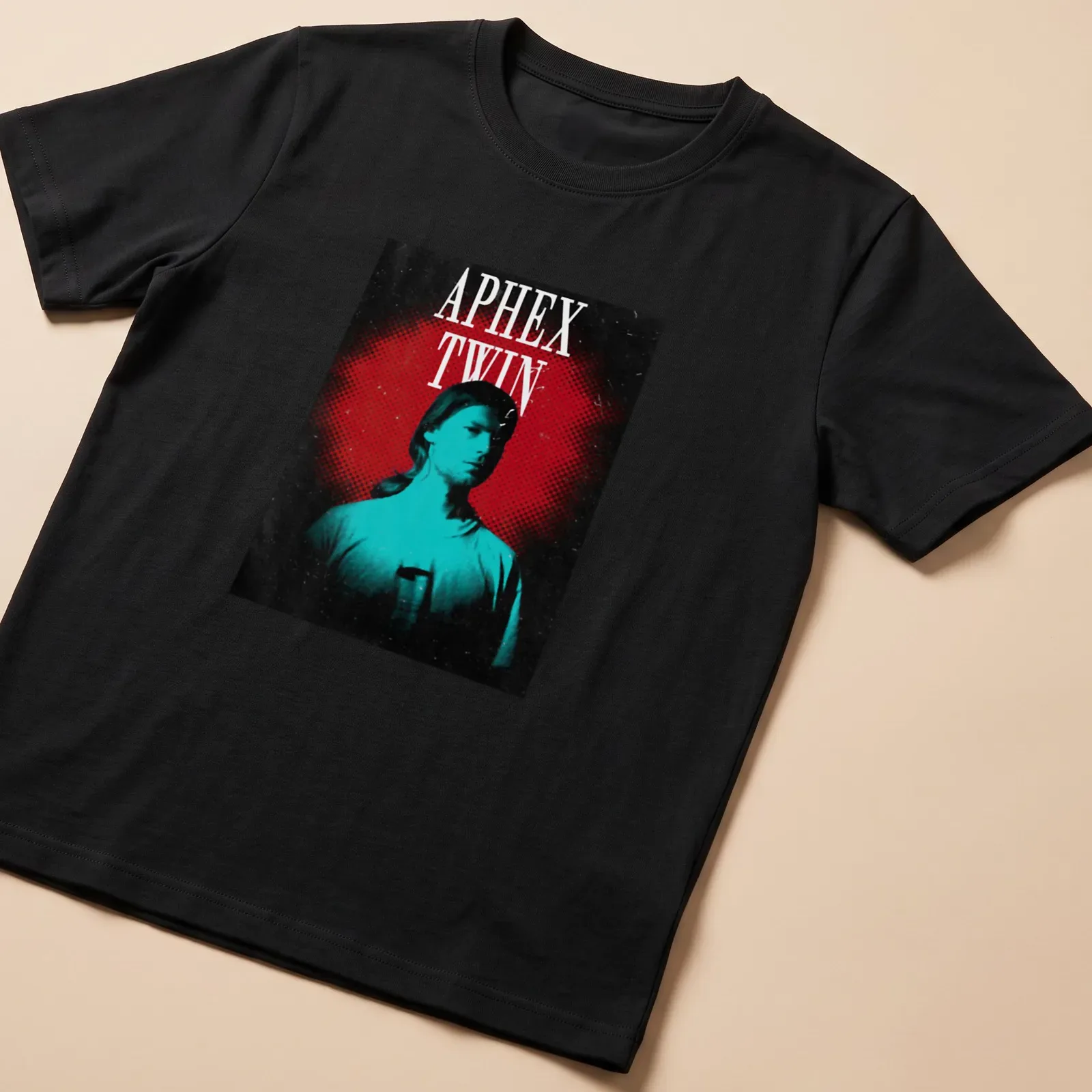 Retro graphic tee featuring a bold portrait of Aphex Twin with colorful text. — printed on a unisex t-shirt