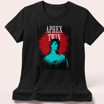 Retro graphic tee featuring a bold portrait of Aphex Twin with colorful text. — printed on a women's shirt