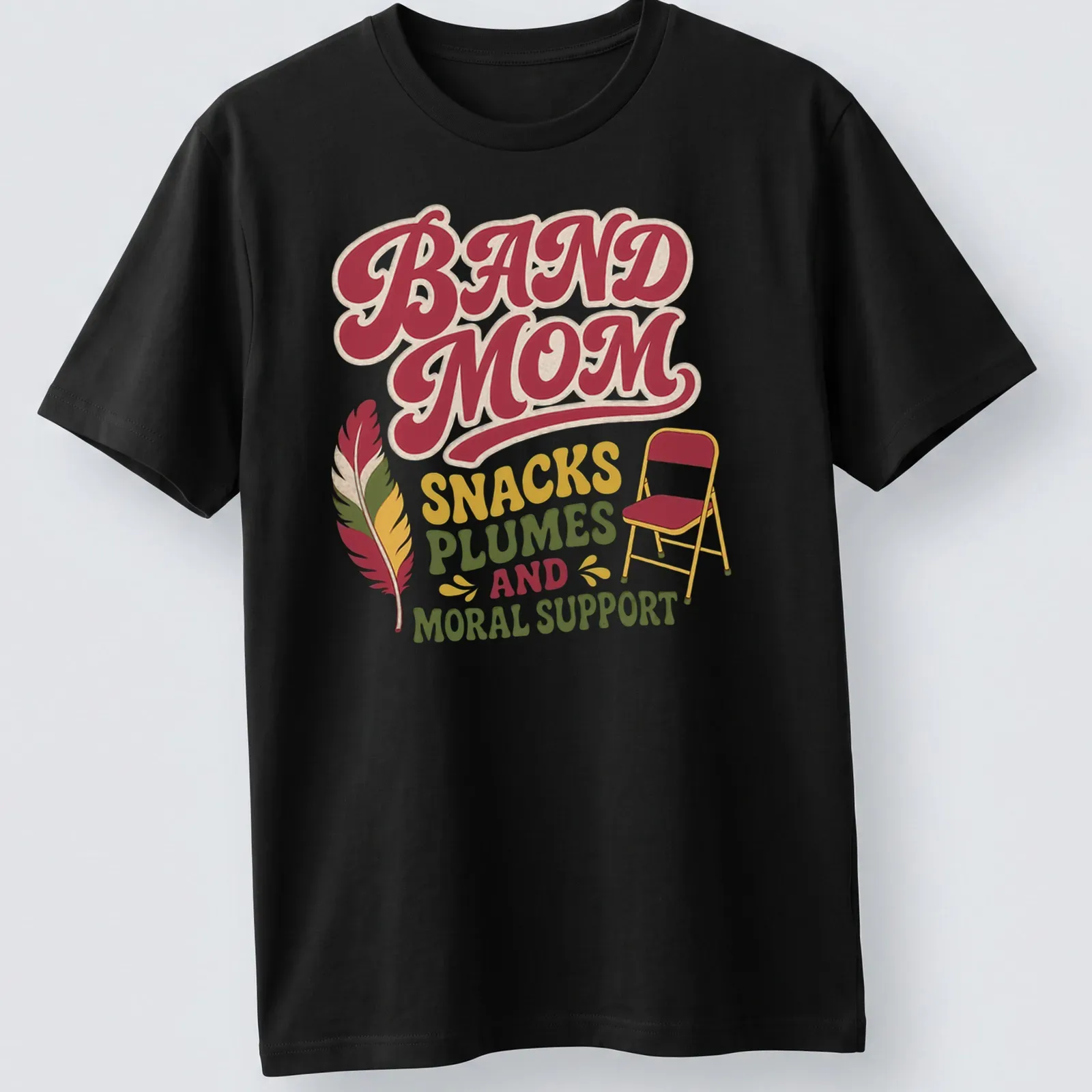 Retro Band Mom t-shirt featuring playful text with chair and feather graphics — printed on a unisex t-shirt