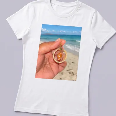 Orange shell jewelry in beach photography style with woven hoops — printed on a women's shirt