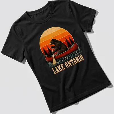 Vintage illustration of a bear canoeing with Lake Ontario text in warm colors — printed on a women's shirt