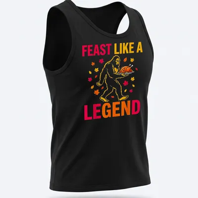 Bigfoot carrying a turkey with the text 'Feast Like A Legend' in colorful cartoon style. — printed on a tank top
