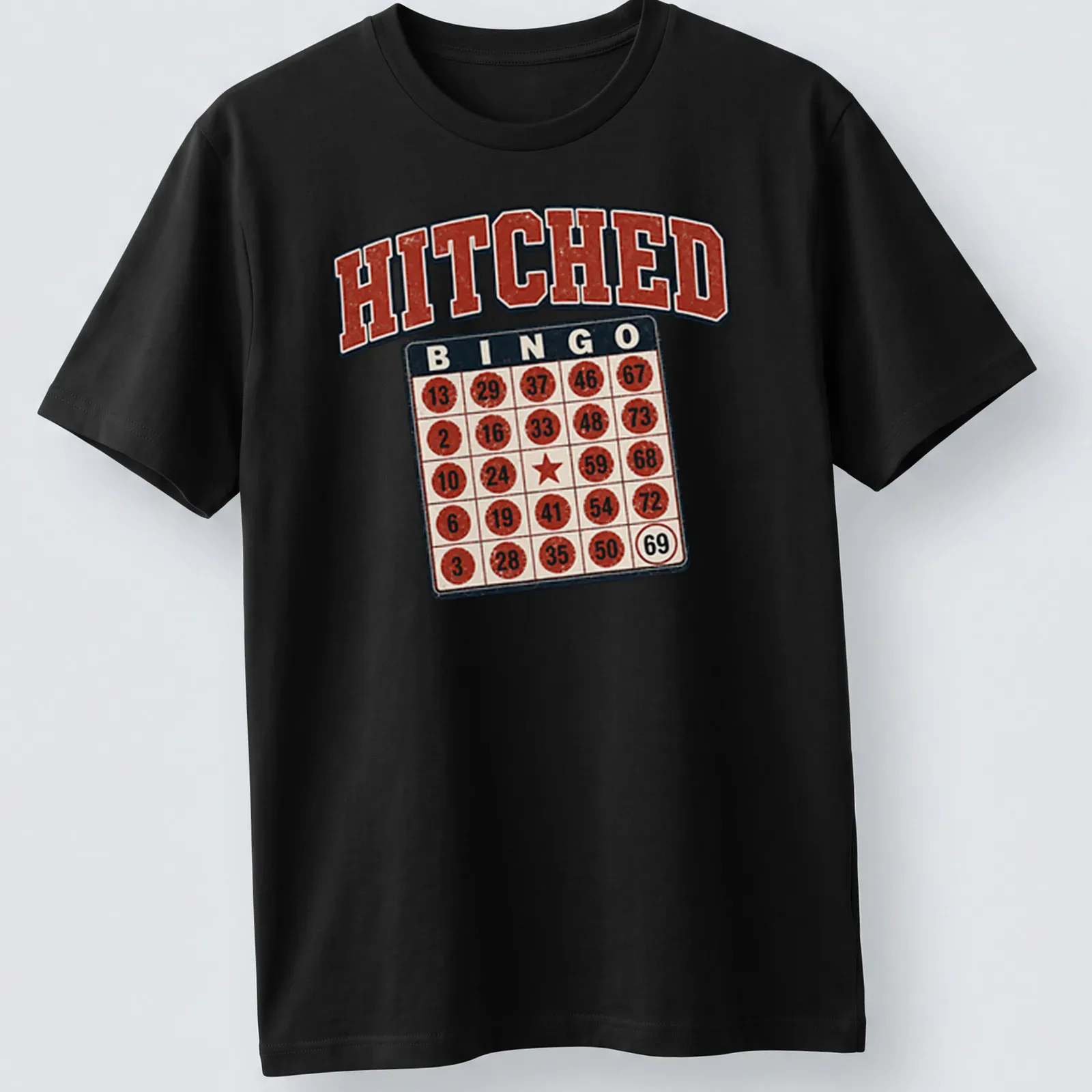 Vintage distressed Bingo Hitched t-shirt featuring a bingo card and humorous text. — printed on a unisex t-shirt