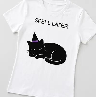 Cartoon of a sleeping black cat with the text 'Spell Later' in purple — printed on a women's shirt