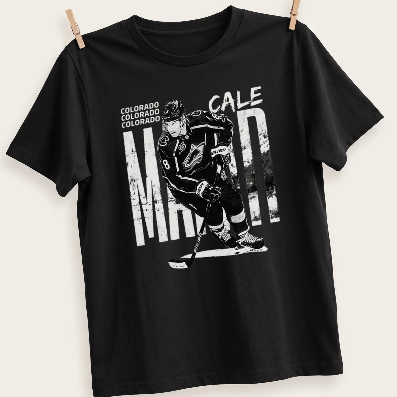 Vintage-style Colorado Cale Makar hockey player t-shirt in black and white — printed on a unisex t-shirt