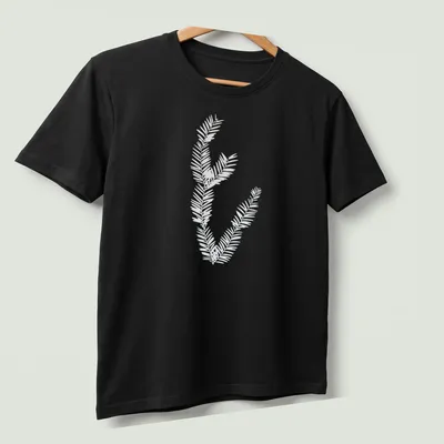 Cyanotype print of California redwood leaves in light blue and white — printed on a unisex t-shirt (angled view)