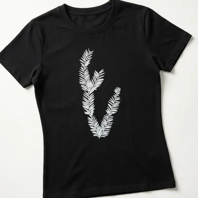 Cyanotype print of California redwood leaves in light blue and white — printed on a women's shirt