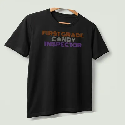 Halloween-themed shirt with a playful Candy Inspector character and colorful stripes — printed on a unisex t-shirt (angled view)
