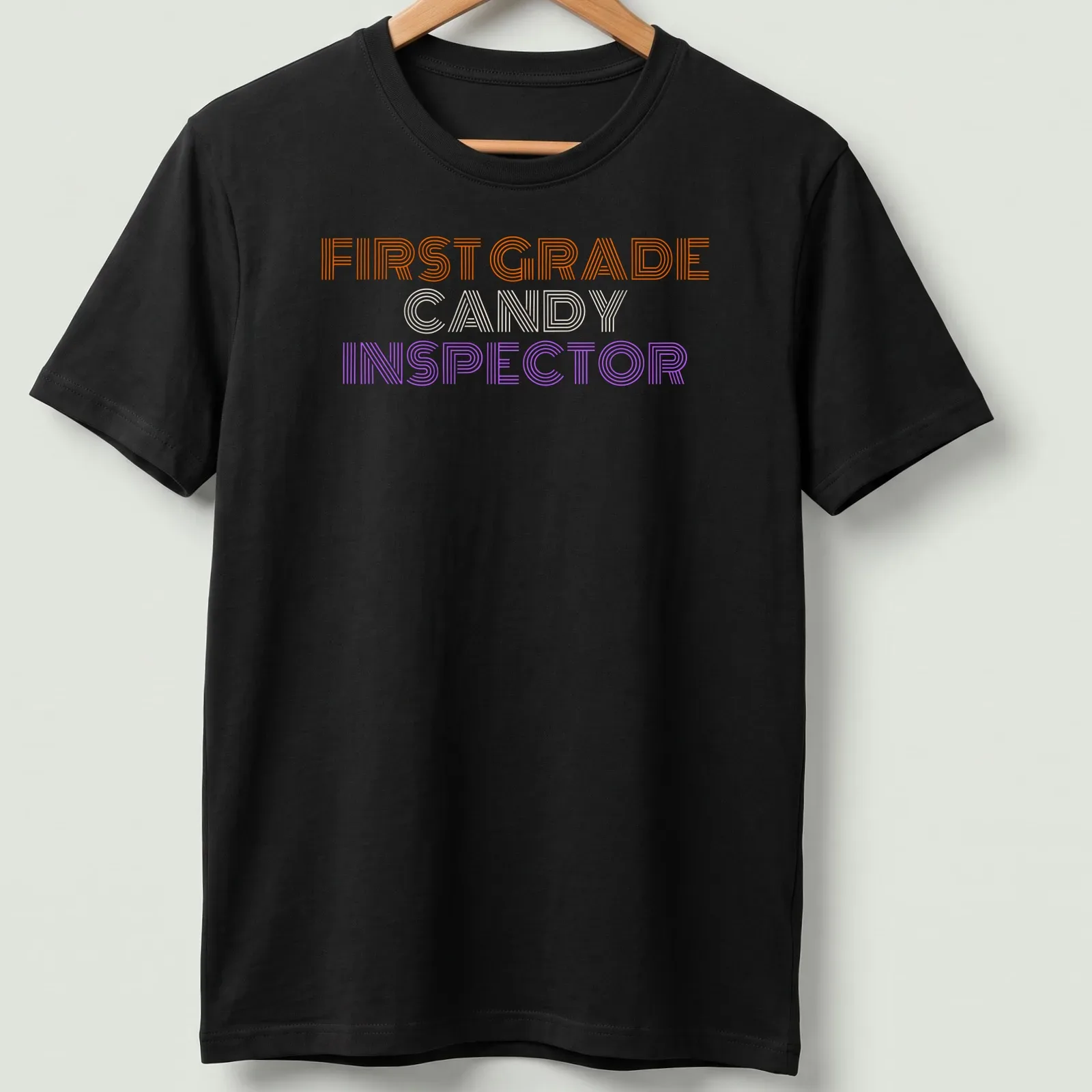 Halloween-themed shirt with a playful Candy Inspector character and colorful stripes — printed on a unisex t-shirt