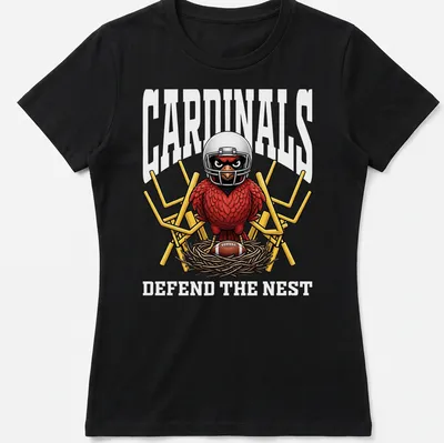 Bold cartoon cardinal in a football helmet with text 'CARDINALS DEFEND THE NEST' — printed on a women's shirt