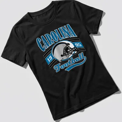 Retro Carolina Football T-shirt featuring a helmet and bold lettering. — printed on a women's shirt