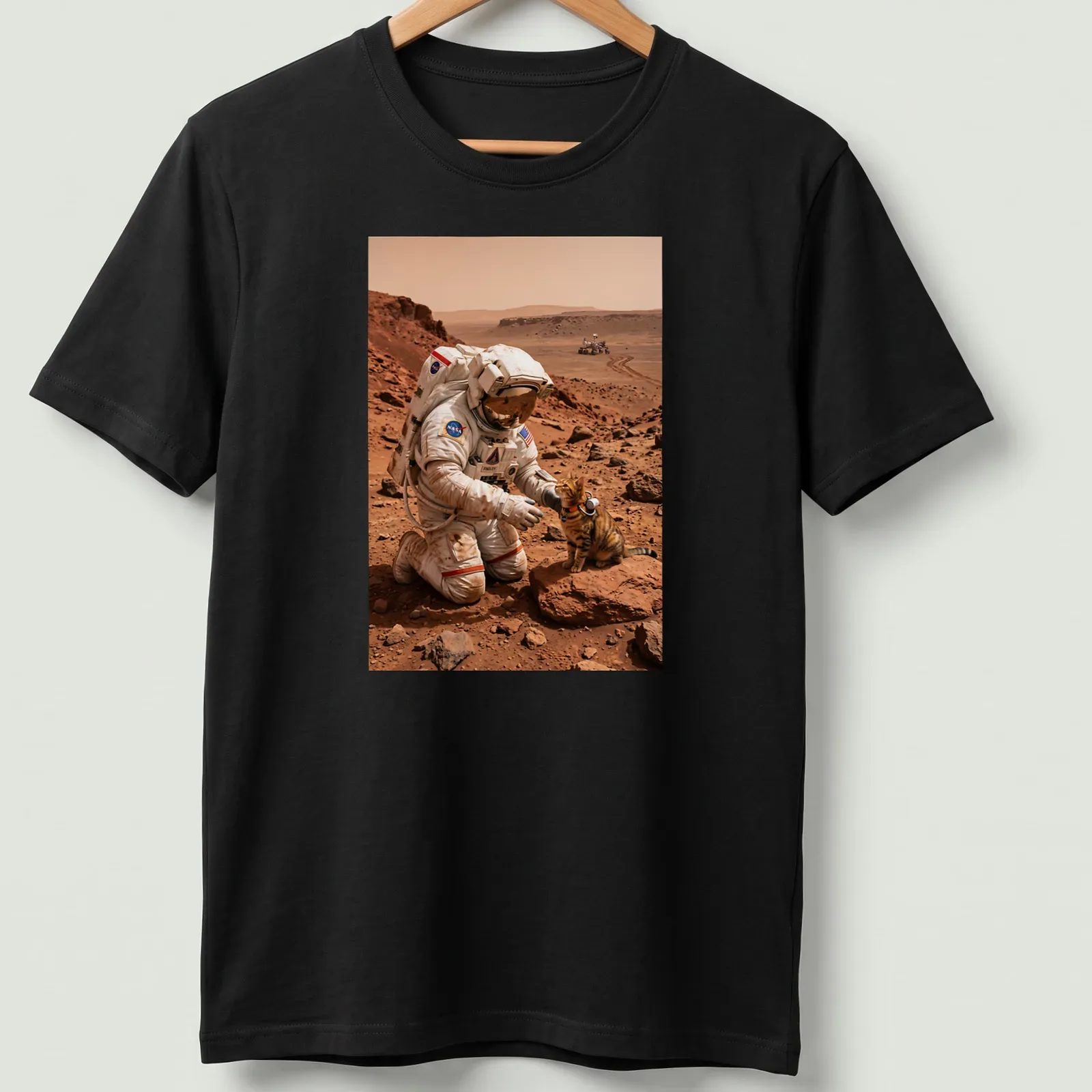 Realistic illustration of a cat exploring Mars with an astronaut in orange and brown hues — printed on a unisex t-shirt