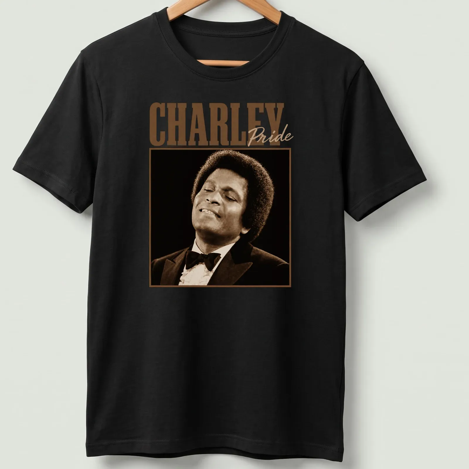 Vintage Charley Pride t-shirt featuring bold typography in brown and beige — printed on a unisex t-shirt