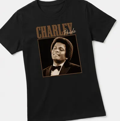 Vintage Charley Pride t-shirt featuring bold typography in brown and beige — printed on a women's shirt