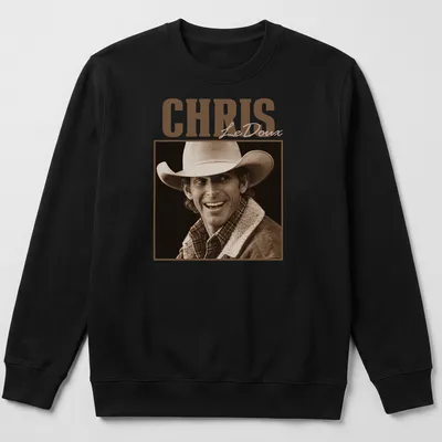 Vintage sepia Chris LeDoux T-shirt featuring a cowboy illustration in brown and cream. — printed on a unisex sweatshirt