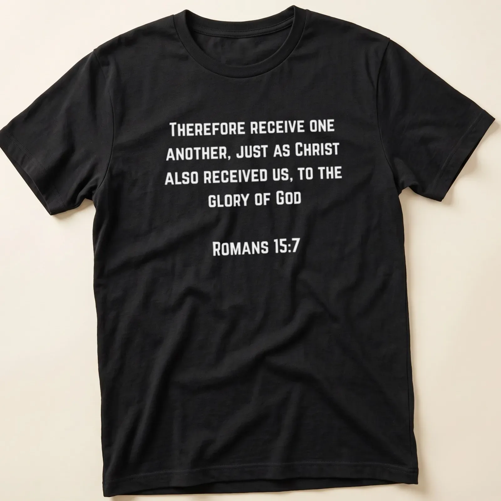 Modern typography design with the text Romans 157 Receive One Another in black and white. — printed on a unisex t-shirt