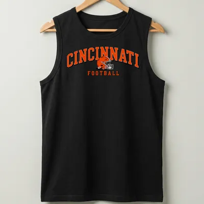 Retro Cincinnati football helmet design in orange, black, and white with bold lettering. — printed on a tank top