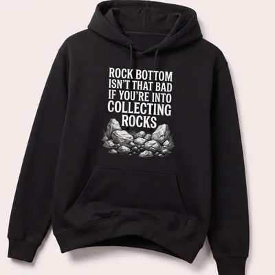 Sketch illustration of various rocks with humorous text about collecting rocks — printed on a unisex hoodie