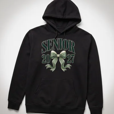 Elegant T-shirt featuring a coquette bow and graduation year in green and white — printed on a unisex hoodie
