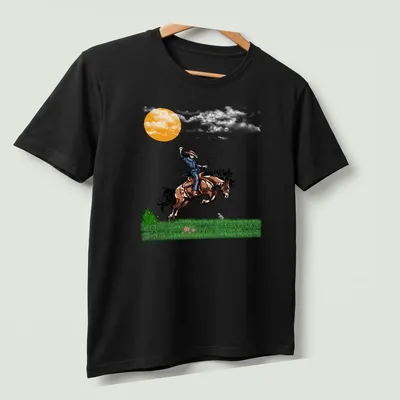 Vibrant illustration of a cowboy riding a horse at sunset with printed text 'Fight Or Flight' — printed on a unisex t-shirt (angled view)