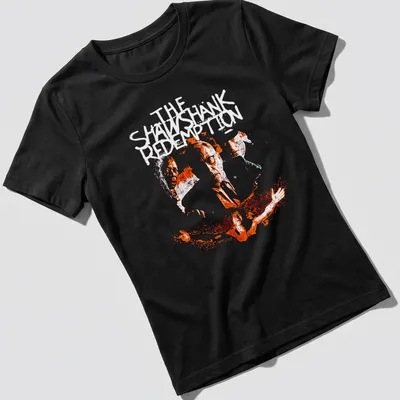 Boxy silhouette design featuring crime drama faces and the words THE SATANIC in white on orange — printed on a women's shirt