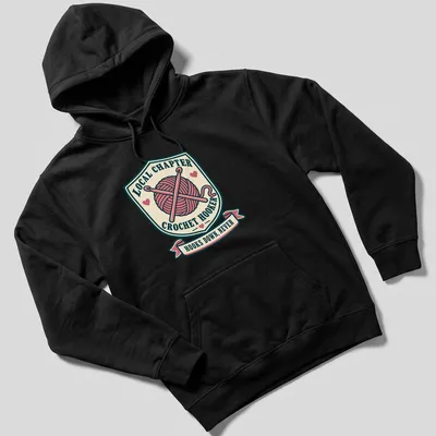 Vintage badge-style t-shirt with crochet hooks and humorous text about crocheting — printed on a unisex hoodie