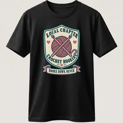 Vintage badge-style t-shirt with crochet hooks and humorous text about crocheting — printed on a unisex t-shirt