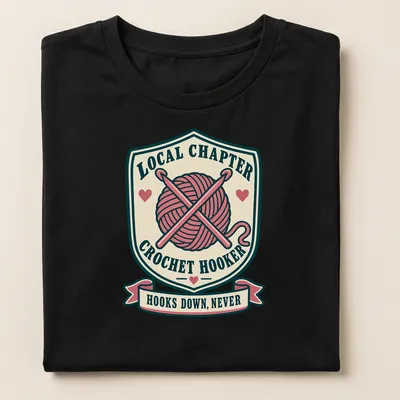 Vintage badge-style t-shirt with crochet hooks and humorous text about crocheting — printed on a women's shirt