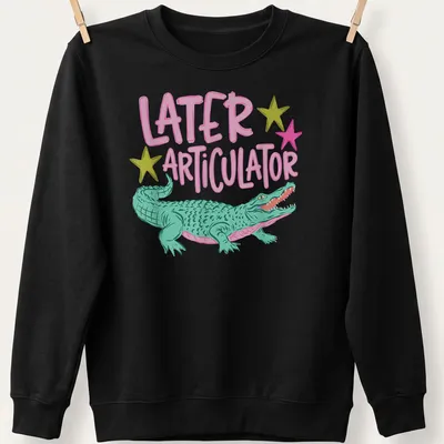 Cartoon crocodile with text 'Later Articulator' in bright colors — printed on a unisex sweatshirt