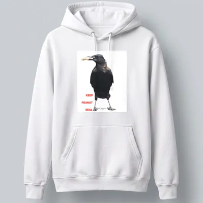 A photographic crow design with the text 'KEEP PEANUT REAL' in black and white. — printed on a unisex hoodie