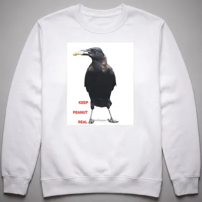 A photographic crow design with the text 'KEEP PEANUT REAL' in black and white. — printed on a unisex sweatshirt