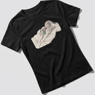 Realistic print of a cute cat stretching towards a colorful feather toy — printed on a women's shirt