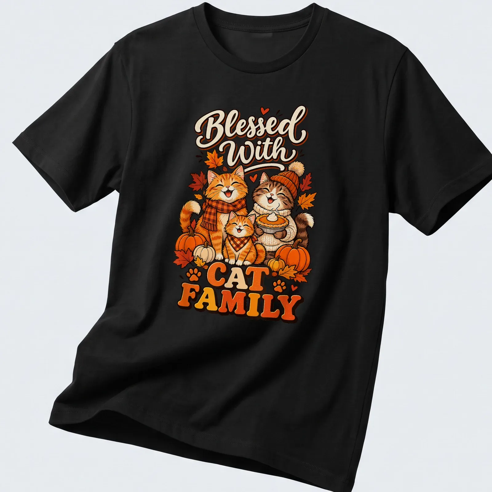 Cute cartoon cat family surrounded by autumn leaves with the phrase Blessed With Cat Family — printed on a unisex t-shirt