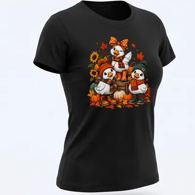 Colorful cartoon design of cute ducks in cozy sweaters for autumn. — printed on a women's shirt