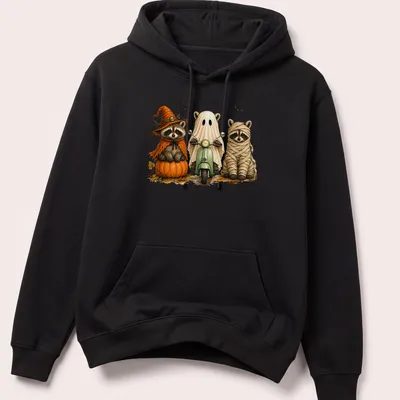 Vintage illustration of three cute raccoons in Halloween costumes on a scooter — printed on a unisex hoodie