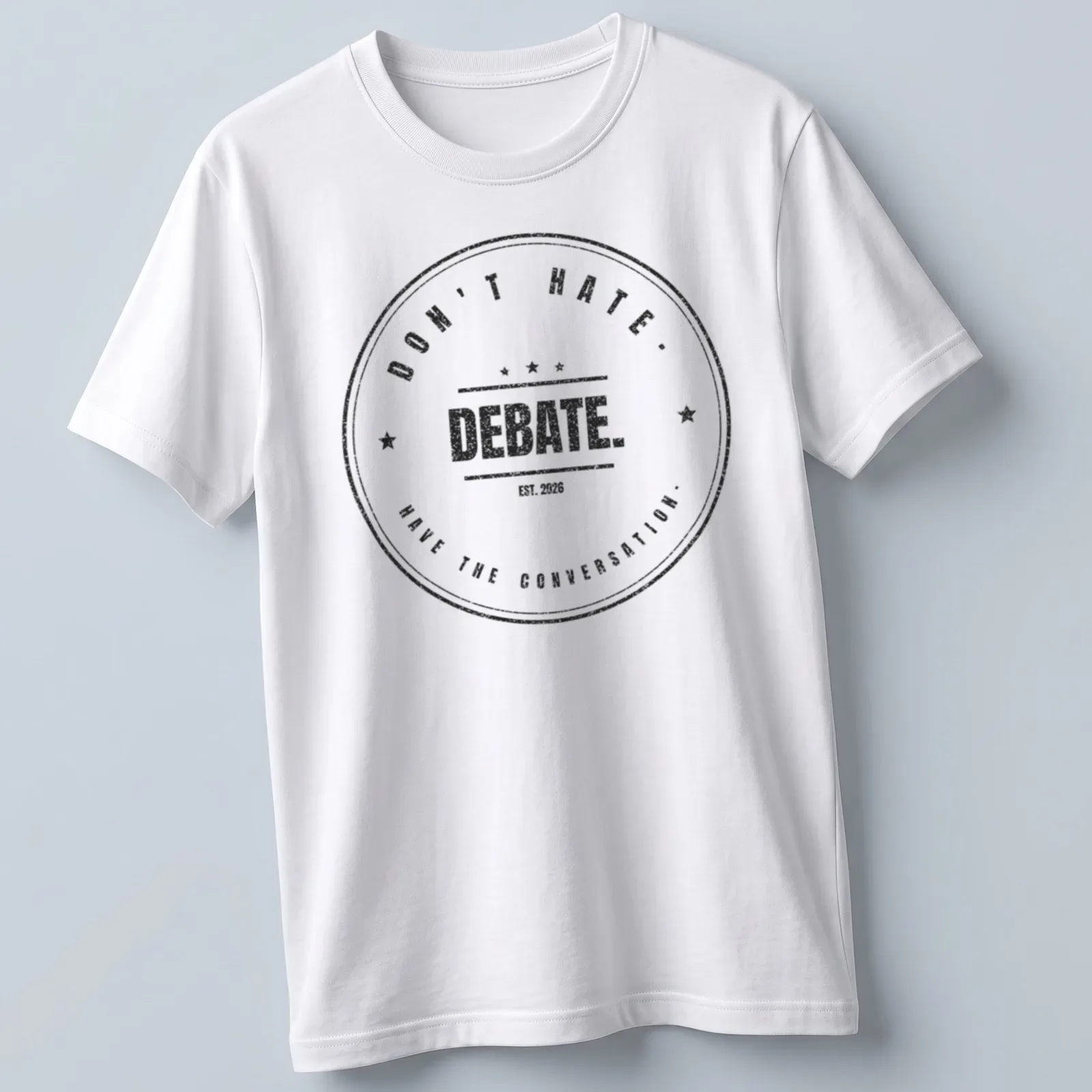 Vintage distressed badge design with the text Don't Hate. Debate. Have The Conversation. — printed on a unisex t-shirt