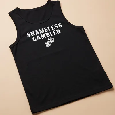 Black and white illustration of dice with the text Shameless Gambler — printed on a tank top