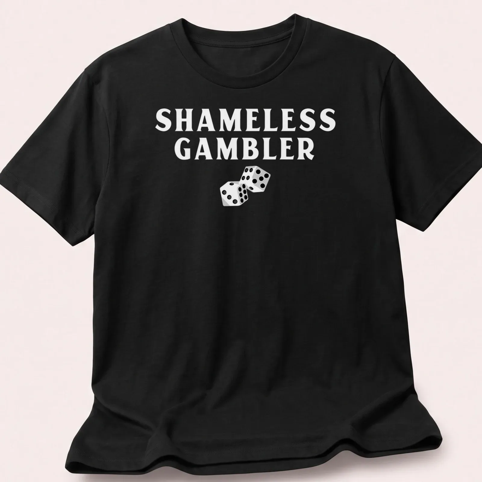 Black and white illustration of dice with the text Shameless Gambler — printed on a unisex t-shirt