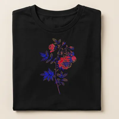 Dramatic rose illustration in red, blue, green, and black on — printed on a women's shirt
