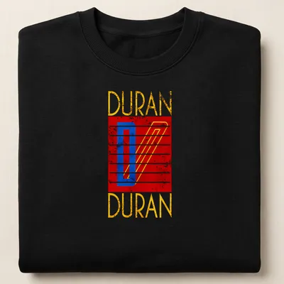 Retro distressed Duran Duran logo t-shirt in red, blue, yellow, and white — printed on a unisex sweatshirt