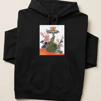 Colorful collage of a falcon and floral elements with bold text The Big Falcon — printed on a unisex hoodie