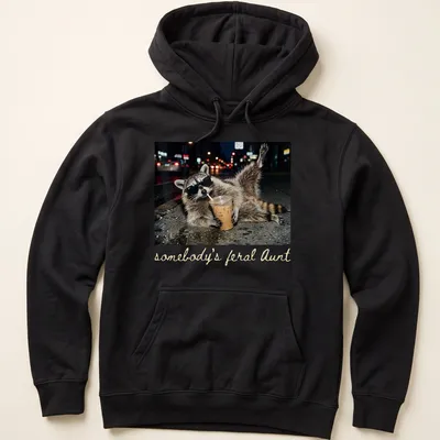 Photorealistic raccoon holding a coffee cup with the phrase 'somebody's feral Aunt' above it. — printed on a unisex hoodie