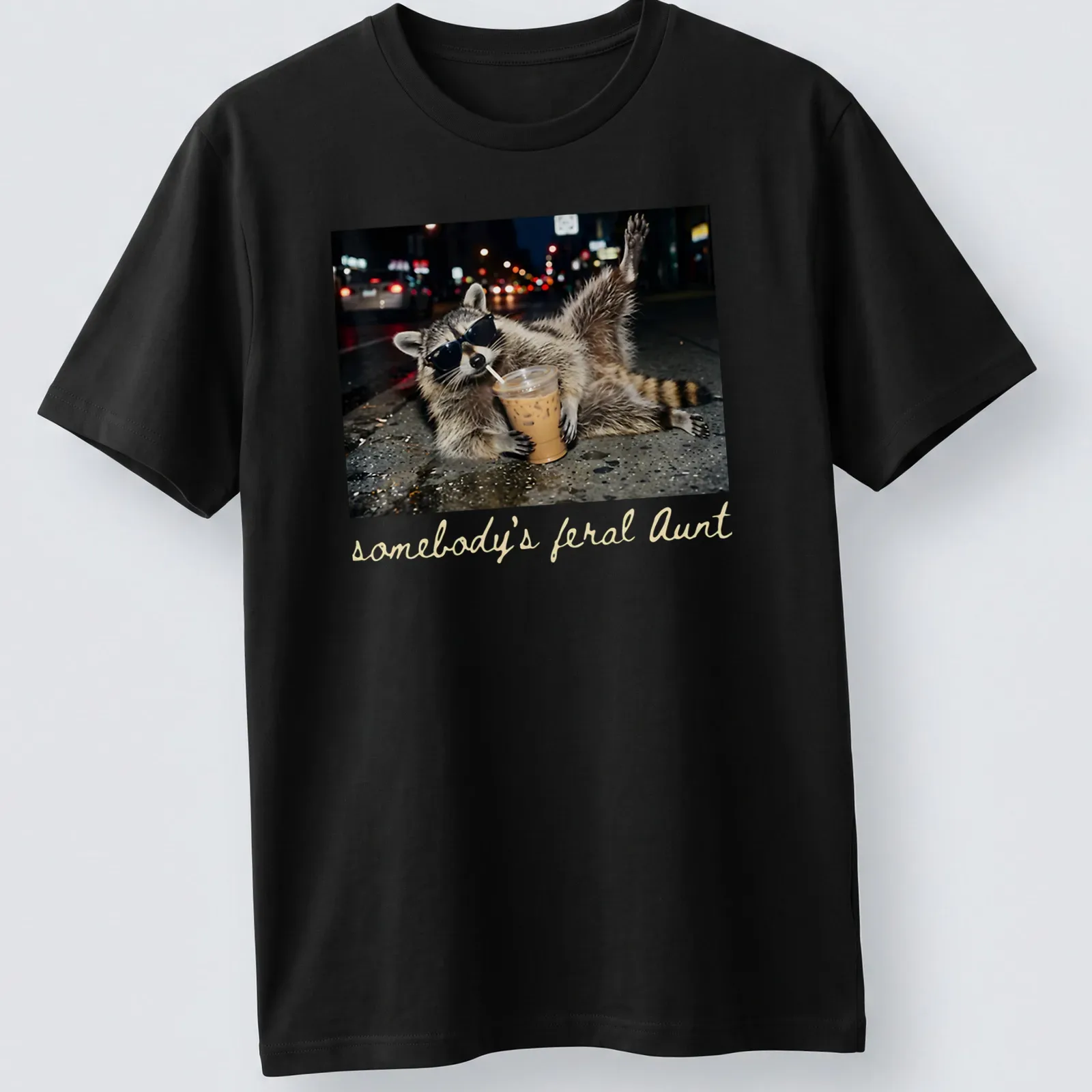Photorealistic raccoon holding a coffee cup with the phrase 'somebody's feral Aunt' above it. — printed on a unisex t-shirt