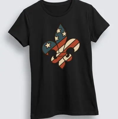 Bold Fleur De Lis on an American flag background with red, white, blue, and cream colors. — printed on a women's shirt
