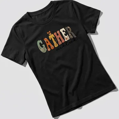 Cottagecore style t-shirt featuring floral autumn design with the word GATHER vechtick — printed on a women's shirt